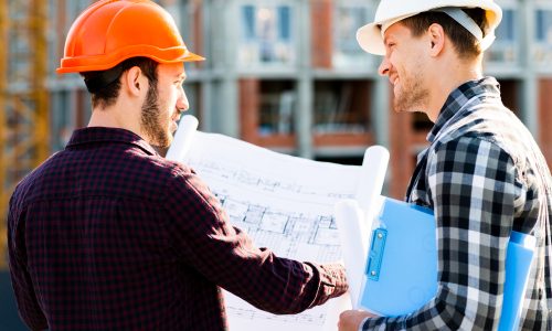 close-up-back-view-engineer-architect-supervising-construction